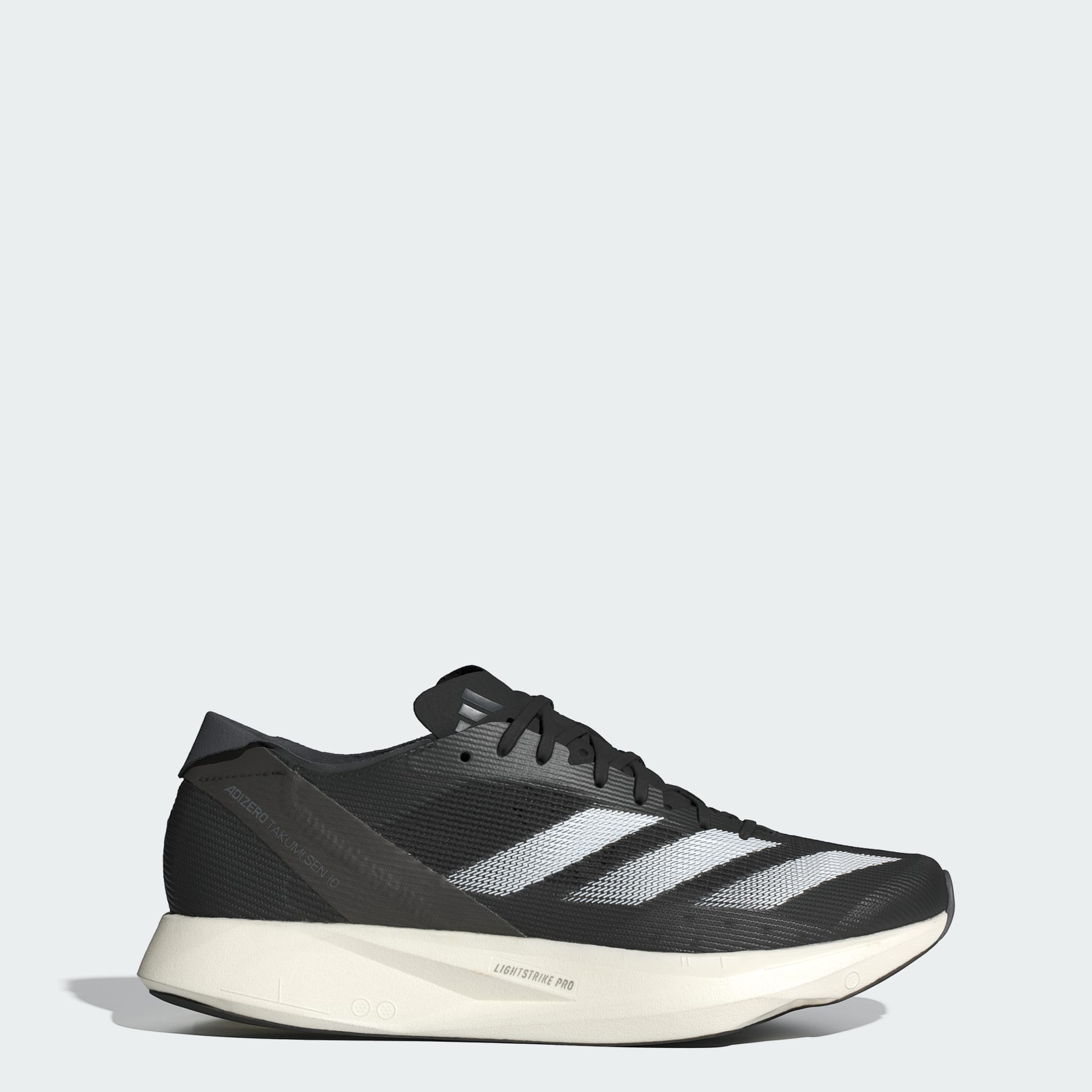 White Adidas Adizero Takumi Sen 10 road racing shoe shown in lateral profile