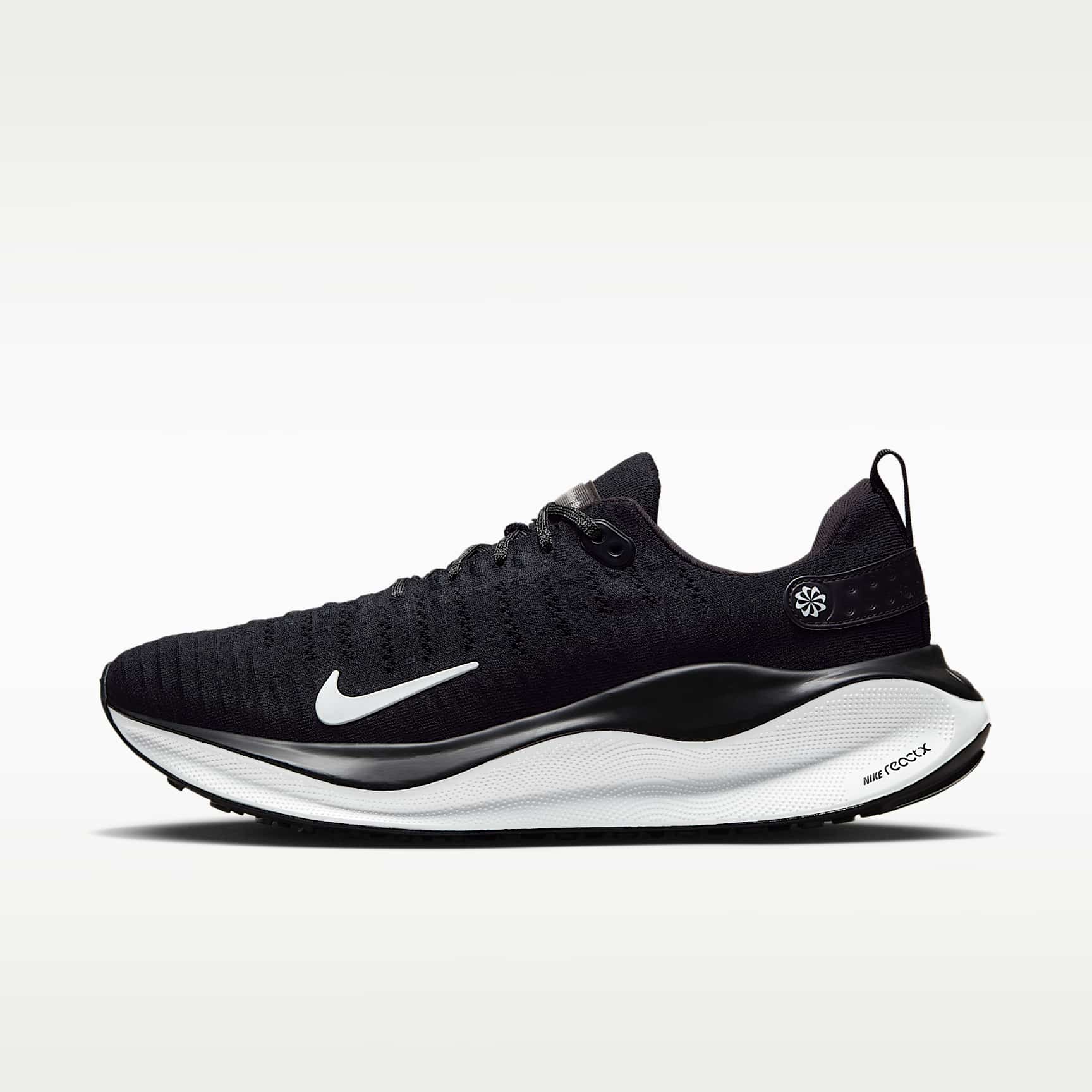 White and orange Nike InfinityRN 4 road running shoe in lateral profile